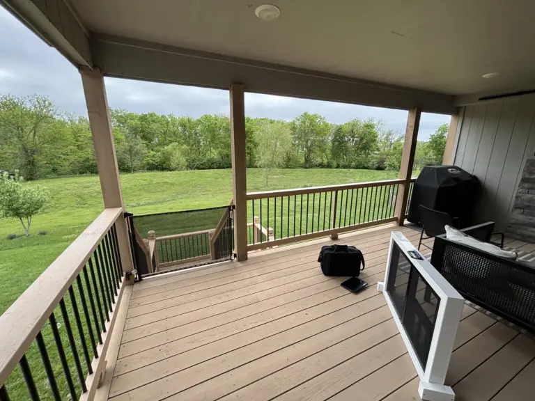 Before: an open covered porch with wood railing and no screens